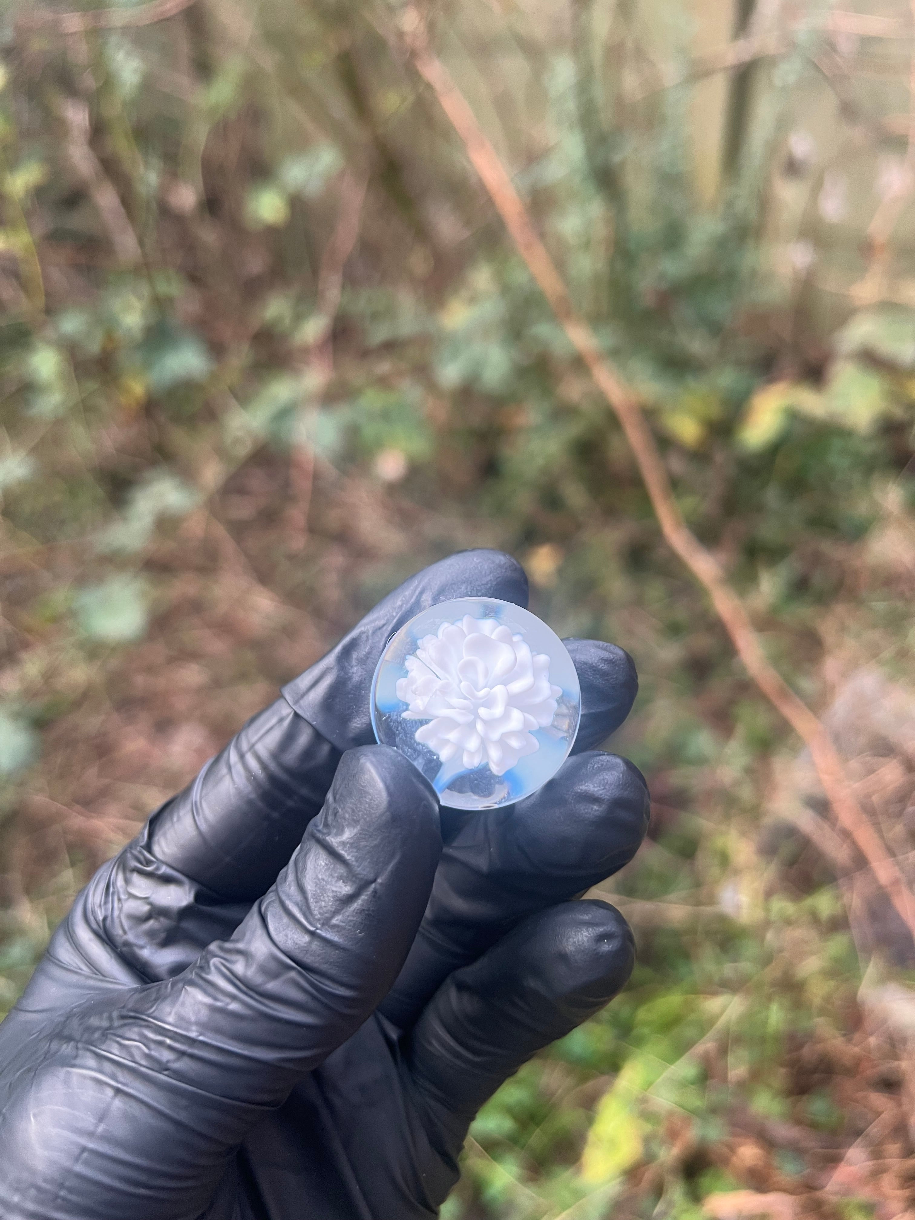 White flower implosion with dots marble